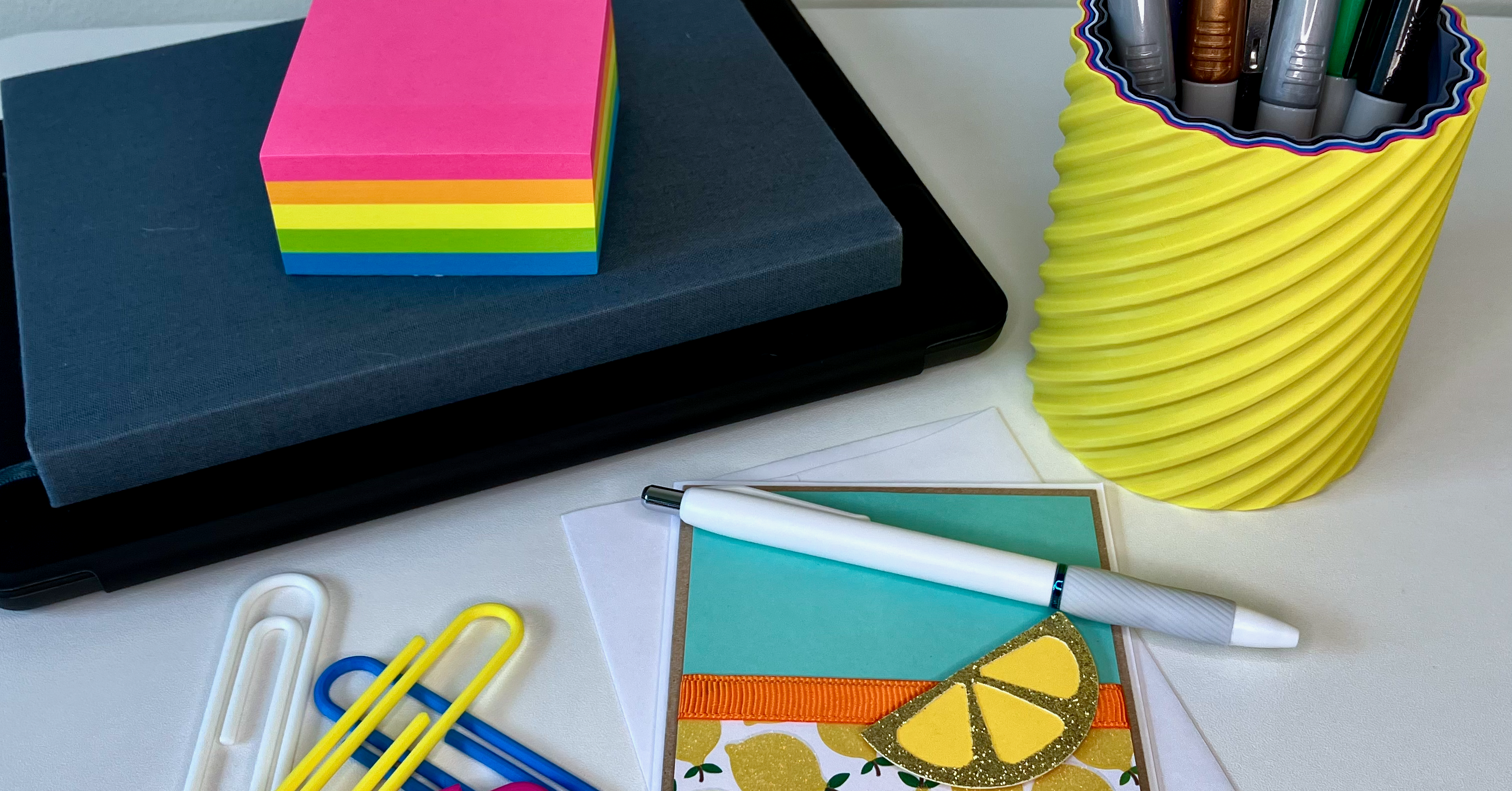 Desktop with a greeting card and 3d printed pen holder