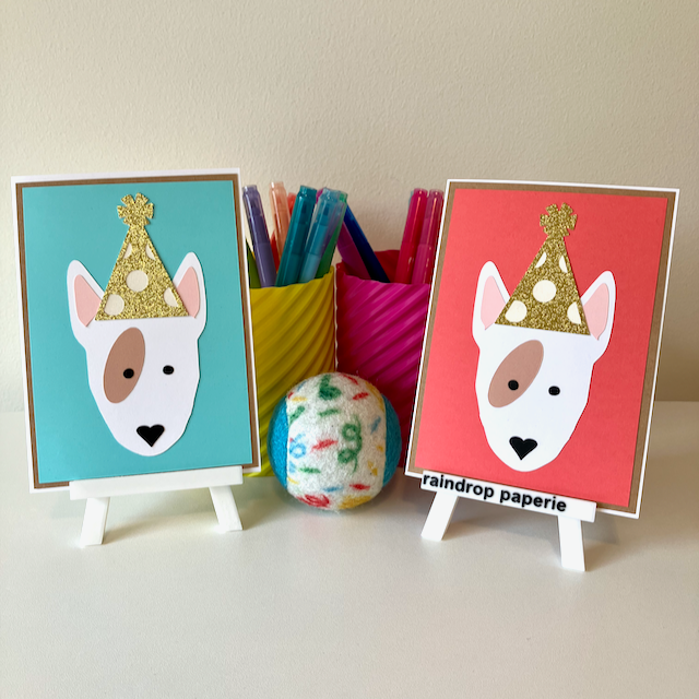 Two handmade greeting cards with English Bull Terriers wearing birthday hats.