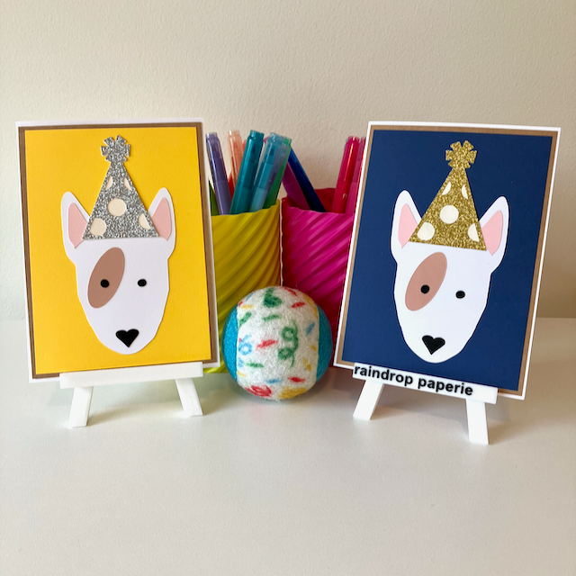 Two handmade greeting cards with English Bull Terriers wearing birthday hats.