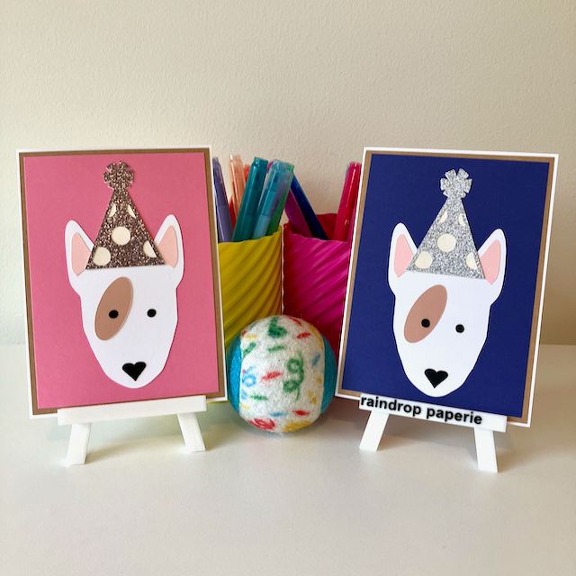 Two handmade greeting cards with English Bull Terriers wearing birthday hats.