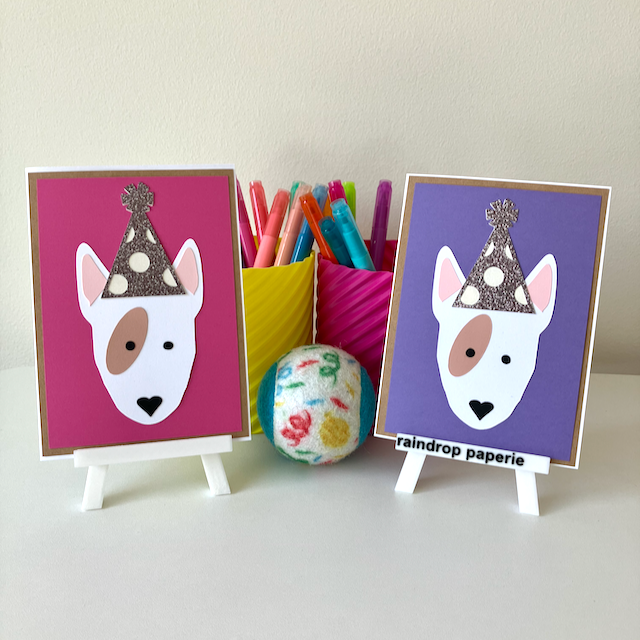 Two handmade greeting cards with English Bull Terriers wearing birthday hats.
