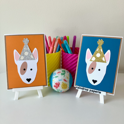 Two handmade greeting cards with English Bull Terriers wearing birthday hats.
