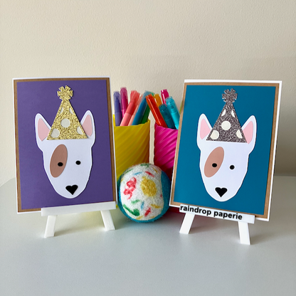 Two handmade greeting cards with English Bull Terriers wearing birthday hats.