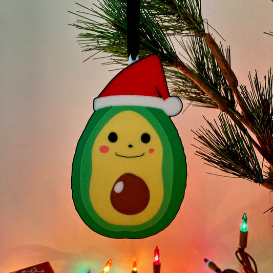 Avocado with a red Santa hat