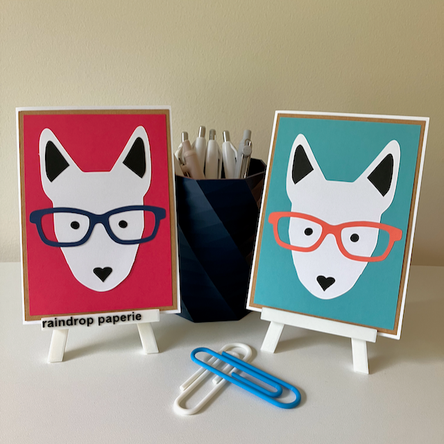 Two handmade greeting cards with English Bull Terrier faces wearing glasses. 