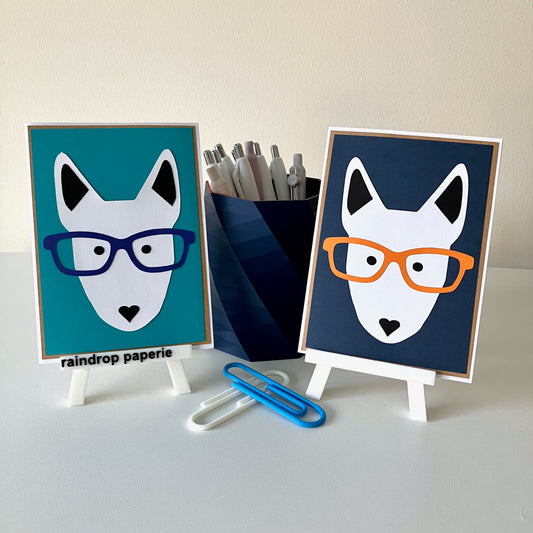 Two handmade greeting cards with English Bull Terrier faces wearing glasses. 