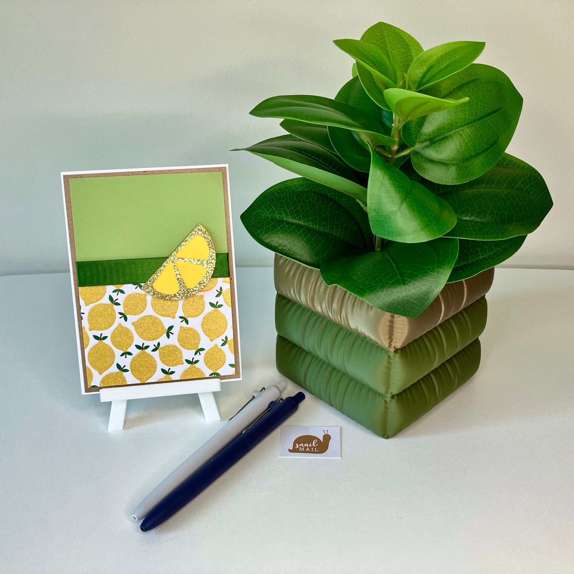 Plant Pot in Green/Bronze on a desk