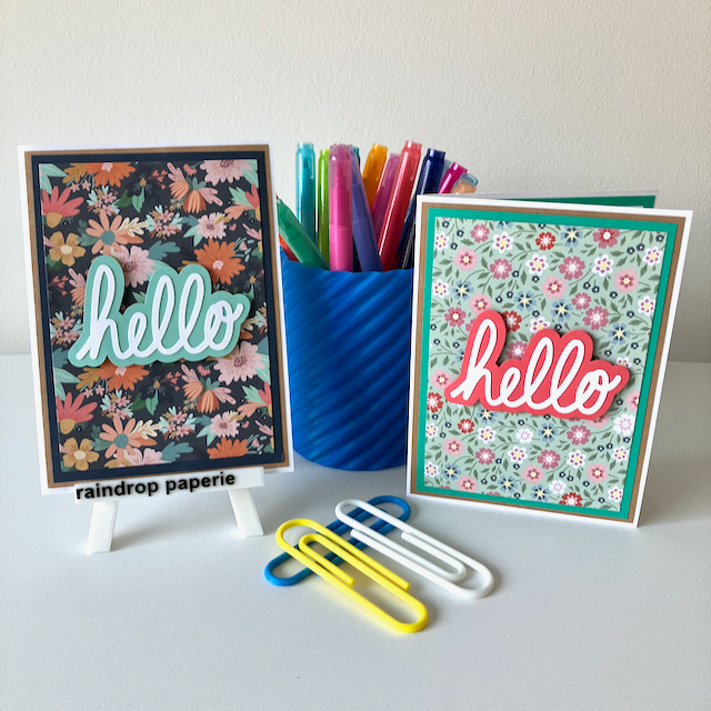 A set of handmade greeting cards with 'Hello' text, accompanied by floral designs, displayed on a white surface.