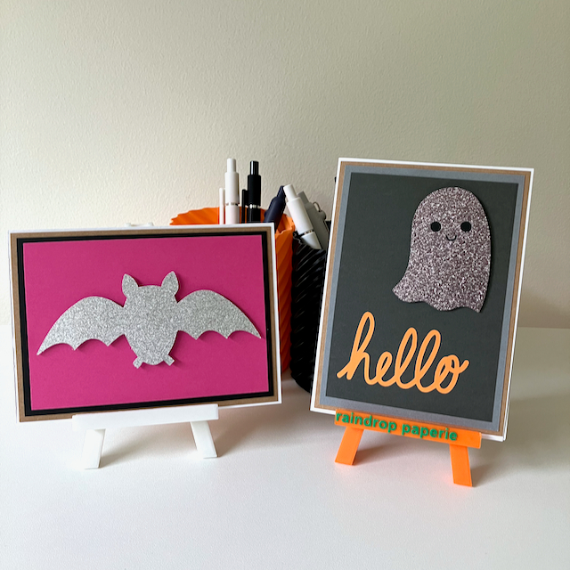 Two handmade Halloween greeting cards with glitter ghost and bat. 