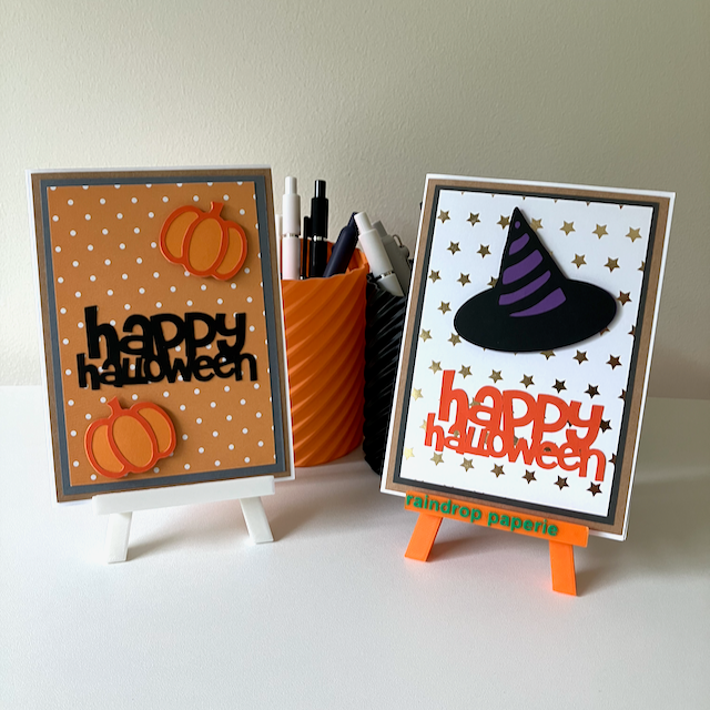 Two handmade Halloween greeting cards with pumpkins and a witches hat.