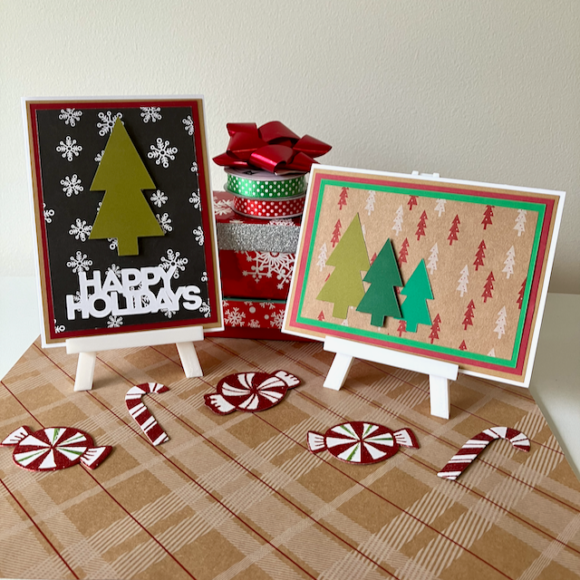 Two Christmas-themed cards on mini easels with decorative ribbons and candy canes on a plaid surface.